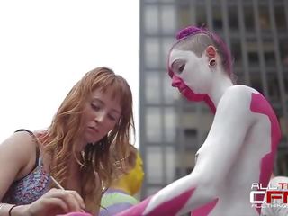 Group Of Naked People Get Painted In Front Of Publ