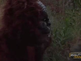 Wonderful super sexy blonde slut with big tits fucking with a gorilla in nature