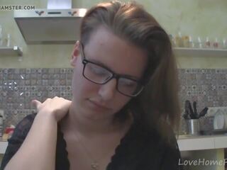 Solo girl with glasses chatting in the kitchen