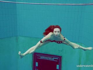 Lonely but energetic teen Nina swims naked