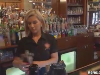 Bartender sucks cock behind counter